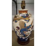 A Satsuma vase with raised and enamelled dragon decoration - permanently lamped