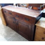 A 5' 2" 19th Century stained oak dresser base with two frieze drawers and pair of panelled