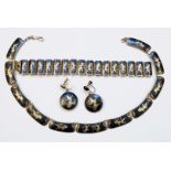 A suite of Siam Sterling marked white metal Nielo work jewellery with temple dancer decoration
