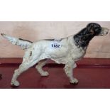 A cast iron setter dog doorstop