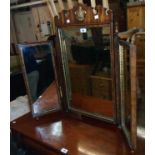 A reproduction mahogany and parcel gilt framed triple dressing table mirror in the late Georgian