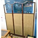 An Edwardian mahogany and strung three fold dressing screen with arcaded tops part glazing missing