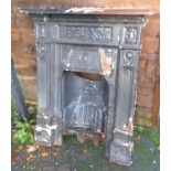A Victorian painted cast iron fireplace