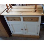 A 36" modern part painted pine dresser base with two short drawers and pair of panelled cupboard