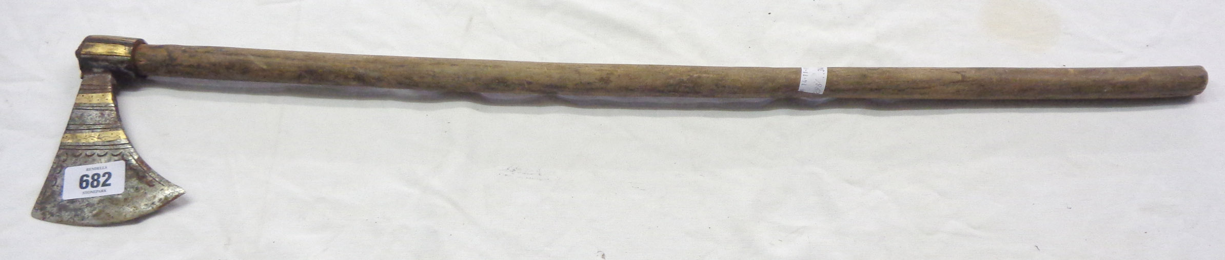 An 19th Century Punjab tabar axe of simple design with brass inlay and incised crescent moons, set