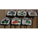 A set of six modern painted cast iron reproduction vegetable labels