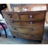 A 3' 5" 19th Century mahogany, cross banded and ebony strung bow front chest of two short and