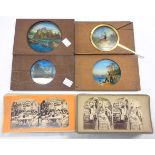 Four antique magic lantern slides including Netley Abbey and a mechanical example depicting a