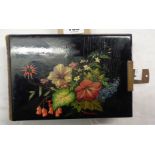 A Victorian photograph album with lacquered floral decorated cover