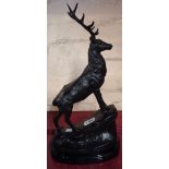 A bronzed stag on a black socle base