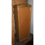 A 26 1/2" modern bamboo mounted, rattan panelled and mixed wood single wardrobe with hanging space