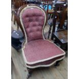 A Victorian walnut part show frame spoon back parlour chair with burgundy repeat pattern tapestry