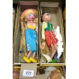 Two vintage Pelham Puppets SS Tyrolean Boy and SS Tyrolean Girl in first type yellow boxes