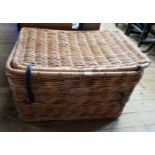 A 35" vintage wicker laundry basket with flanking loop handles