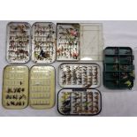 Two vintage metal fishing fly cases and a later similar containing assorted salmon and trout flies -