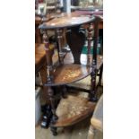 A Victorian inlaid rosewood three tier corner whatnot with graduated surfaces and turned