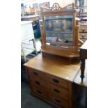 A 36" Edwardian satin walnut dressing chest with bevelled swing mirror, flanking pierced supports