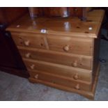 A 29 1/2" modern polished pine chest of two short and three long drawers, set on bracket feet