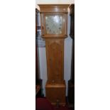 A 19th Century waxed pine longcase clock, the 11" painted square dial with date aperture and seconds