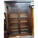 A 5' 3" 19th Century mahogany book cabinet with decorative moulded cornice and flanking acanthus