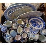 A box containing a quantity of blue and white ceramics