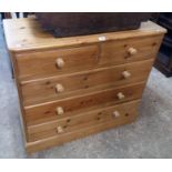A 3' 6" modern polished pine chest of two short and three long drawers, set on plinth base