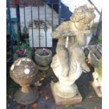 Two garden finials, one with cherub statue atop