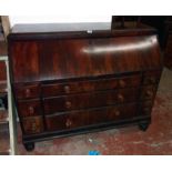 A 4' 6" 19th Century mahogany bureau with fully fitted interior, flanking heavy brass drop handles