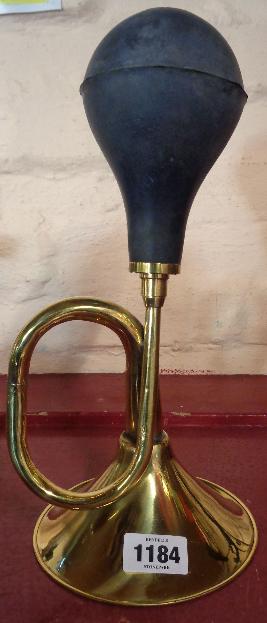 A reproduction brass car horn