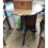 A 26 1/2" diameter 19th Century mahogany pie crust tilt-top pedestal table, set on turned pillar and