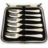 A cased set of six Sheffield silver cake forks