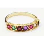 A hallmarked 375 gold ring, set with a row of seven differing coloured gemstones spelling the
