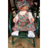 A vintage doll and chair