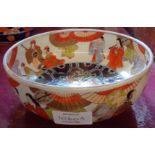 A Meiji period Japanese Imari bowl with Shinto festival scenes to interior and exterior, and typical