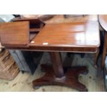 A 36" 19th Century mahogany reading table with opposing ratchet reading slopes and moulded top,