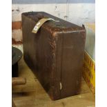 A vintage snakeskin effect leather suitcase