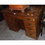 A 3' 9" old waxed pine knee-hole desk with long frieze drawer, central panelled cupboard and six