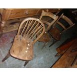 A Glenister of Wycombe hoop stick back kitchen chair with thick solid elm seat bearing maker's stamp