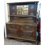 A 5' early 20th Century Arts & Crafts style polished oak two part mirror back sideboard with