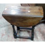 A 20 1/2" 20th Century polished oak joint stool style swivel top occasional table