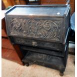 A 30" Victorian carved and stained oak lady's bureau with part fitted interior and mask to frieze