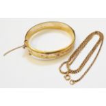 A marked 9/375 yellow metal clasp bracelet with engraved decoration - sold with a marked 9k box-link