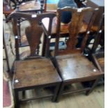 Two Georgian provincial oak standard chairs both with shaped splats and solid seat panels, one set