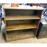 A 36" oak three shelf open bookcase with moulded top and shaped standard ends