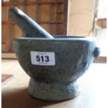 A composite stone pestle and mortar