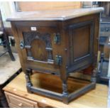 A 32" Old Charm credence style cabinet with carved decoration, studwork and open stretcher base