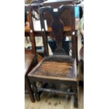 An antique provincial stained elm standard chair in the Queen Anne style with solid seat panel and