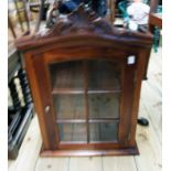 A 16 1/2" reproduction polished hardwood display cabinet with acanthus scroll pediment and beaded