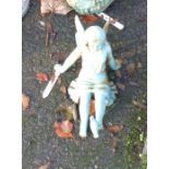 A small painted cast iron garden fairy with bird on her foot