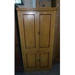 A 36" French painted pine storage cupboard with shelves and compartment enclosed by two pairs of